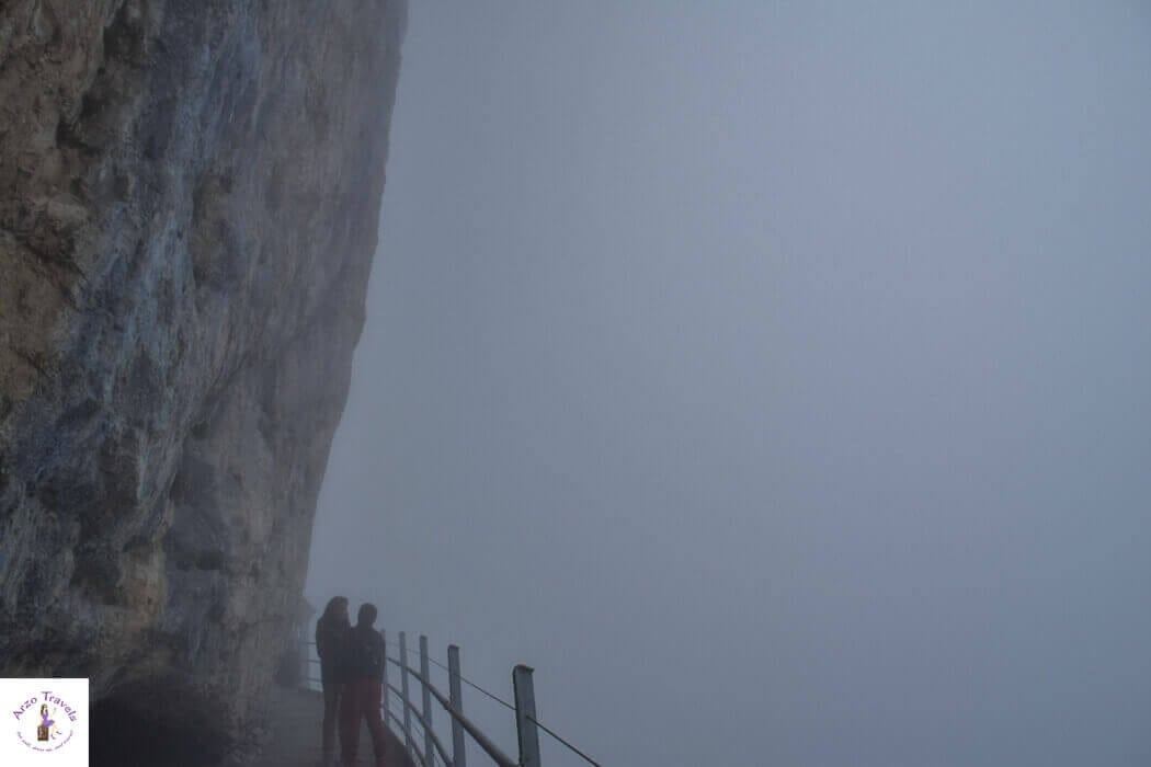 Arzo Travels Hiking on a foggy day in Switzerland